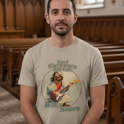 Man wearing a t-shirt with a graphic design of a character playing guitar and text in a church setting