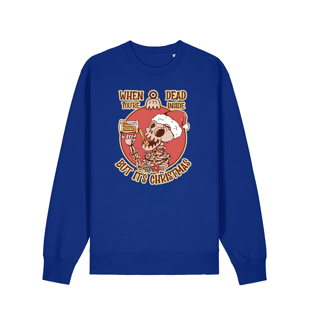 blue christmas jumper with the graphic of a skeleton drinking a beer and the slogan 'when you're dead inside but it's christmas'