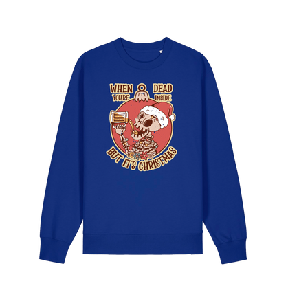 blue christmas jumper with the graphic of a skeleton drinking a beer and the slogan 'when you're dead inside but it's christmas'