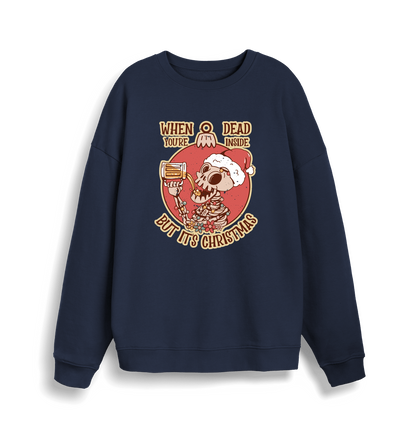 navy christmas jumper with the graphic of a skeleton drinking a beer and the slogan 'when you're dead inside but it's christmas'