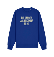 blue christmas jumper with the slogan 'die hard is a christmas film'