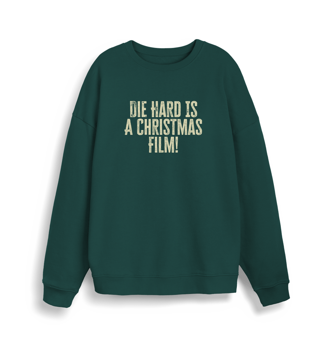 green christmas jumper with the slogan 'die hard is a christmas film'