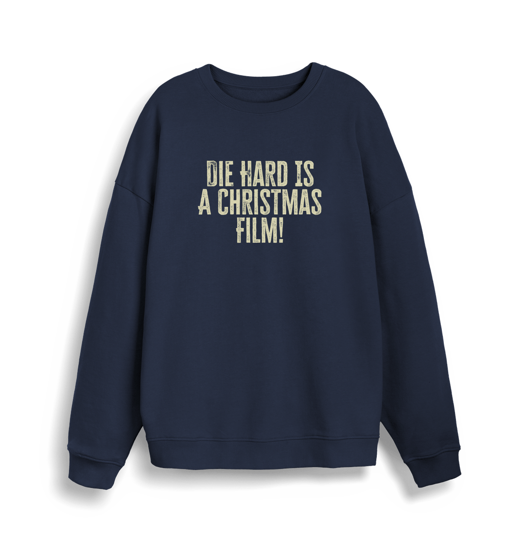 navy christmas jumper with the slogan 'die hard is a christmas film'