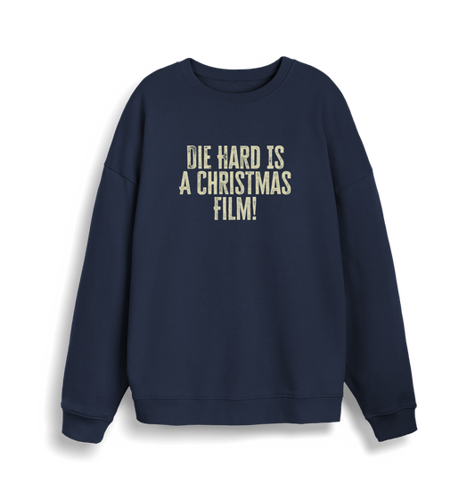 navy christmas jumper with the slogan 'die hard is a christmas film'