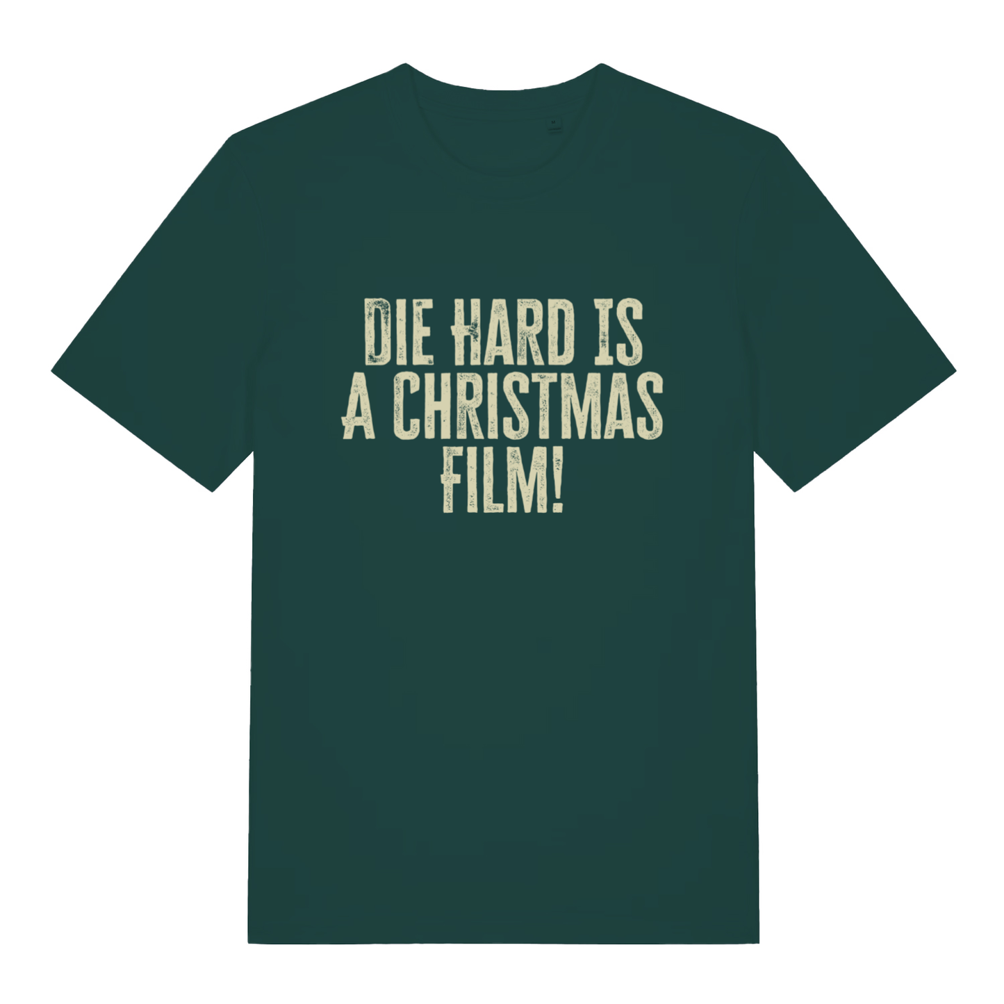 Glazed Green Die Hard Is A Christmas Film T-shirt flat lay showing classic Christmas debate slogan