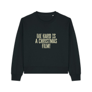 black christmas jumper with the slogan 'die hard is a christmas film'