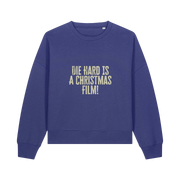 blue christmas jumper with the slogan 'die hard is a christmas film'