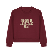 burgundy christmas jumper with the slogan 'die hard is a christmas film'