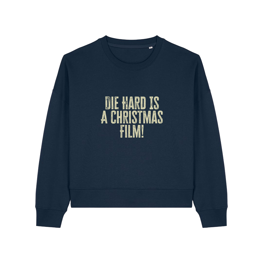 navy christmas jumper with the slogan 'die hard is a christmas film'