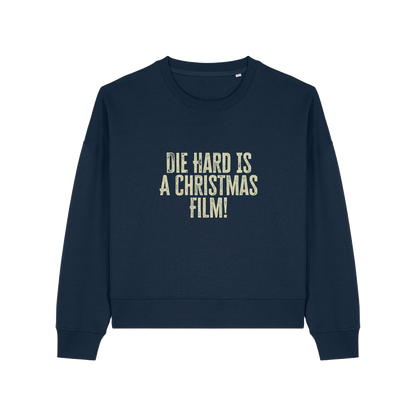 navy christmas jumper with the slogan 'die hard is a christmas film'