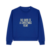 royal blue christmas jumper with the slogan 'die hard is a christmas film'