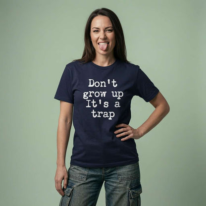 Woman sticking tongue out in french navy Don’t Grow Up It’s a Trap tee, humorous slogan