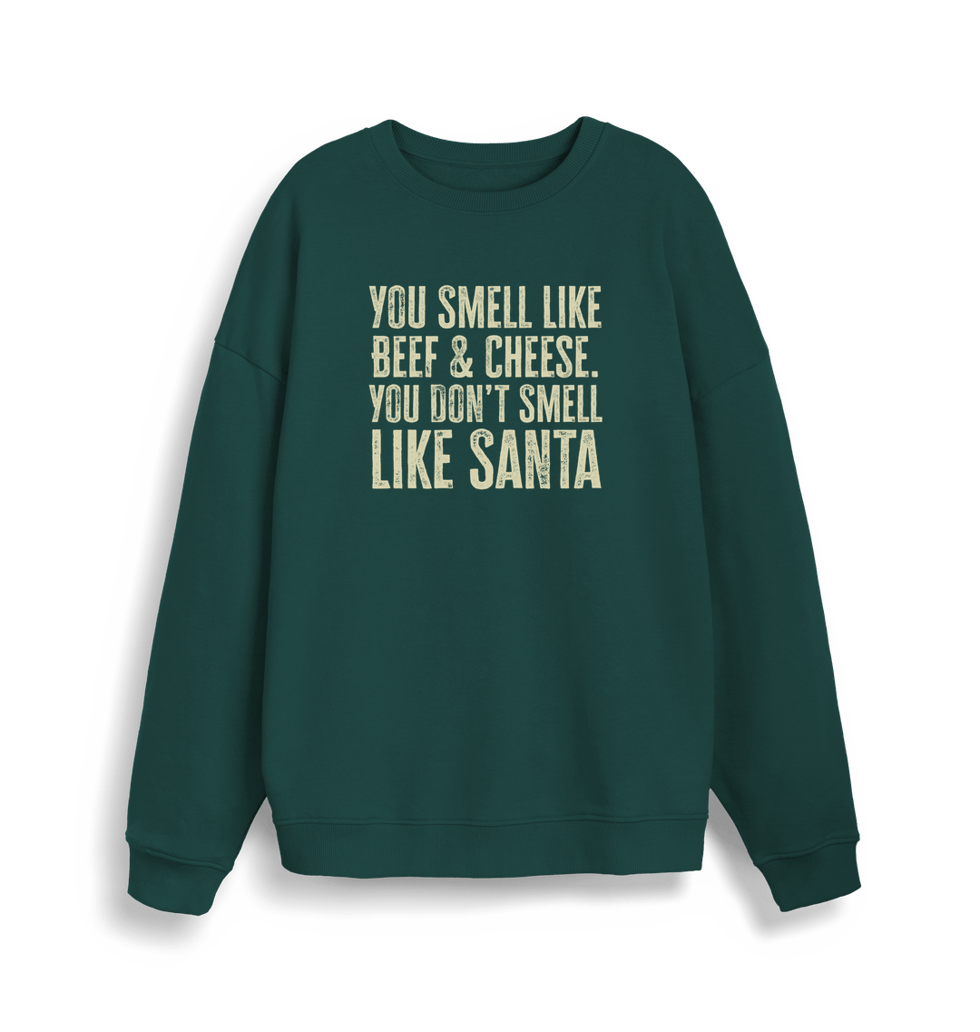 green christmas sweater with the slogan 'you smell like beef and cheese, you dont smell like santa'