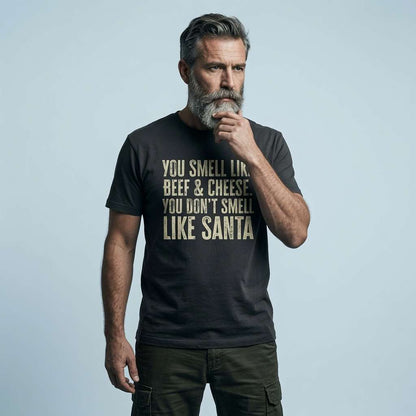 Bearded man thoughtfully posing in black You Smell Like Beef & Cheese tee, witty Christmas slogan