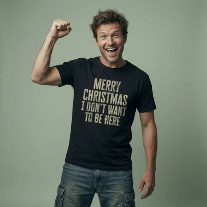 Man cheering with fist raised in black Merry Christmas I Don’t Want To Be Here tee, mens anti-Christmas slogan