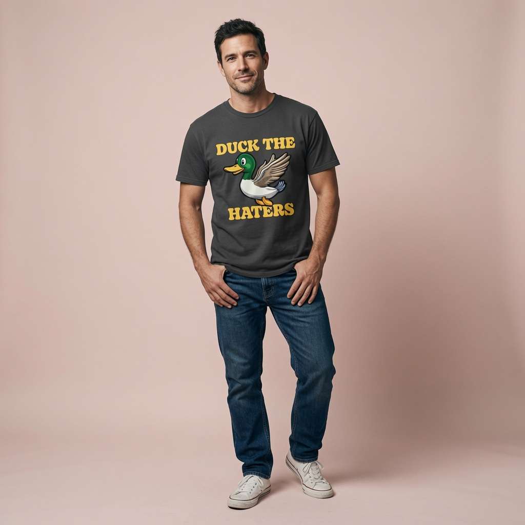 Man standing with hands in pockets in black Duck The Haters t-shirt, funny mens witty duck pun