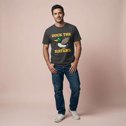 Man standing with hands in pockets in black Duck The Haters t-shirt, funny mens witty duck pun
