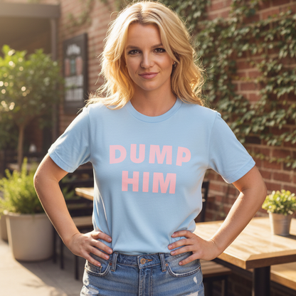 Woman wearing a light blue t-shirt with 'DUMP HIM' in pink text, standing outdoors.