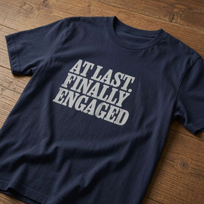 French navy At Last Finally Engaged t-shirt on wood, cheeky matching slogan tee