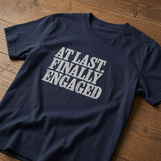 French navy At Last Finally Engaged t-shirt on wood, cheeky matching slogan tee