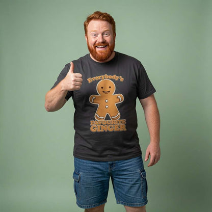 Smiling red-haired man giving thumbs up in black Everybody’s Favourite Ginger tee, funny witty gingerbread man xmas