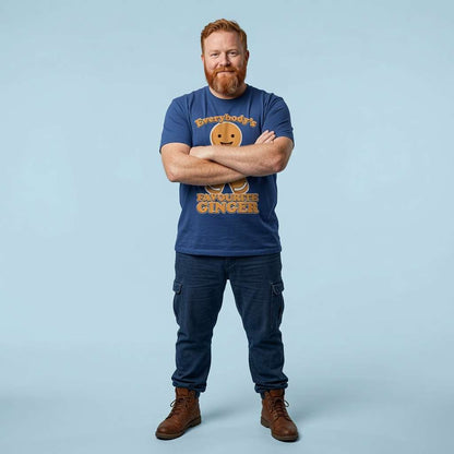 Red-haired bearded man with arms crossed in worker blue Everybody’s Favourite Ginger t-shirt, fun witty xmas graphic