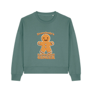 green christmas sweater with the graphic of a gingerbread man and the slogan 'everybodys favourite ginger'
