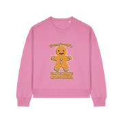 pink christmas sweater with the graphic of a gingerbread man and the slogan 'everybodys favourite ginger'