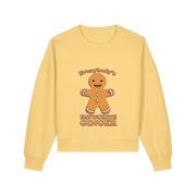 yellow christmas sweater with the graphic of a gingerbread man and the slogan 'everybodys favourite ginger'