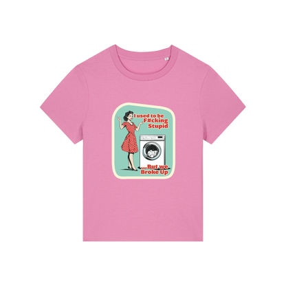 pink funny offensive t-shirt with the graphic of a retro housewife stood next to a washing machine and the slogan 'i used to be fucking stupid .. but we broke up'