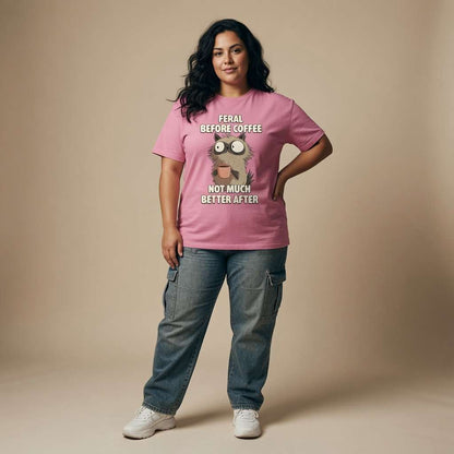 Woman standing with hand on hip in bubble pink Feral Before Coffee tee, ladies coffee pun graphic
