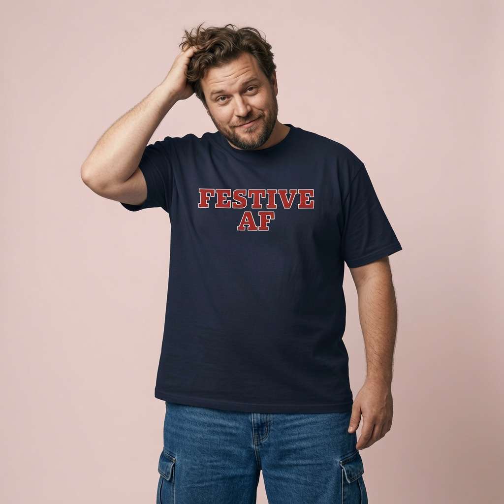 Man smiling with hand in hair in navy Festive AF tee, funny festive wit christmas