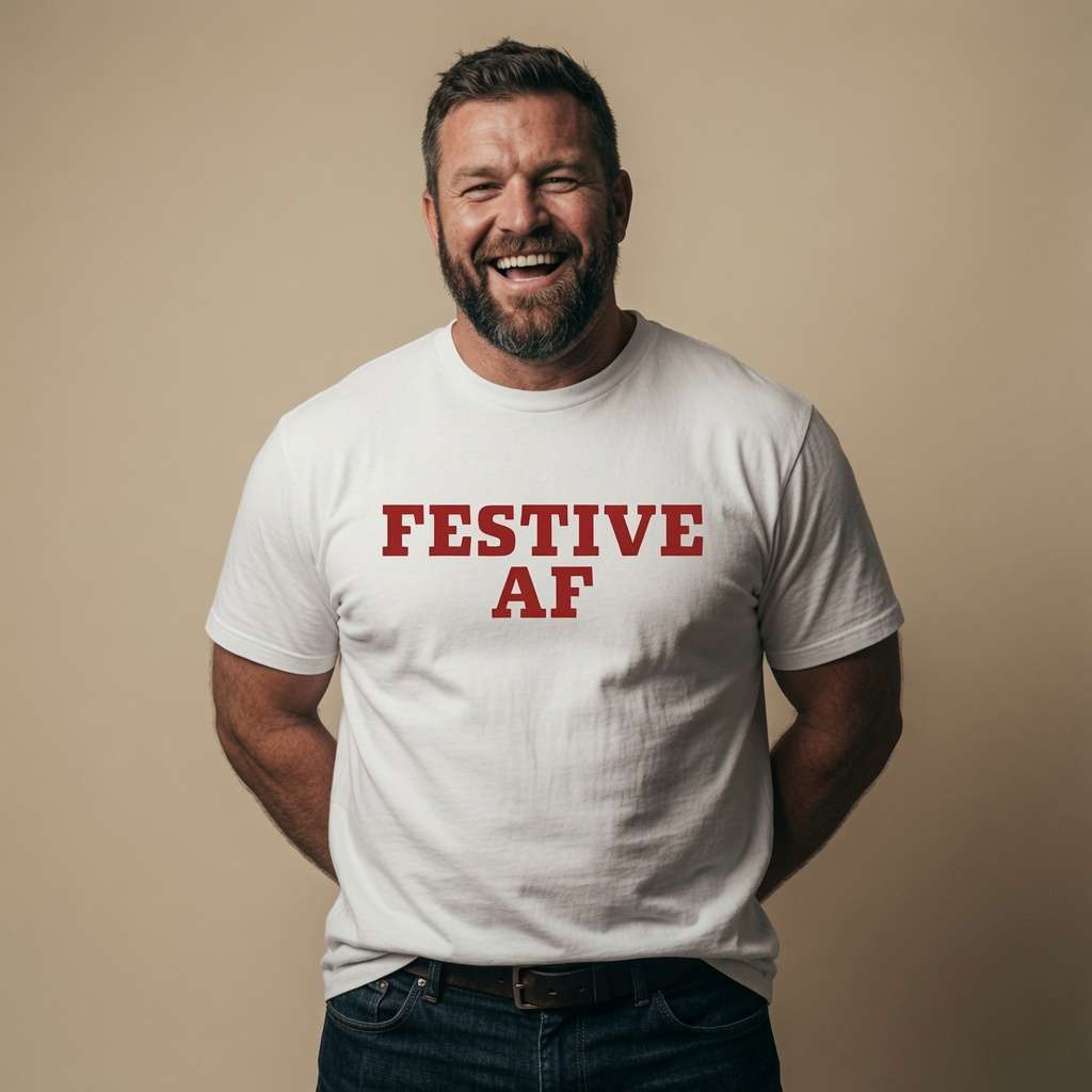 Bearded man laughing with hands behind back in white Festive AF t-shirt, mens funny cheeky xmas festive slogan