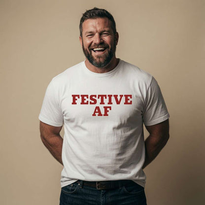 Bearded man laughing with hands behind back in white Festive AF t-shirt, mens funny cheeky xmas festive slogan