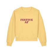 yellow womens christmas sweater with the slogan 'festive af'