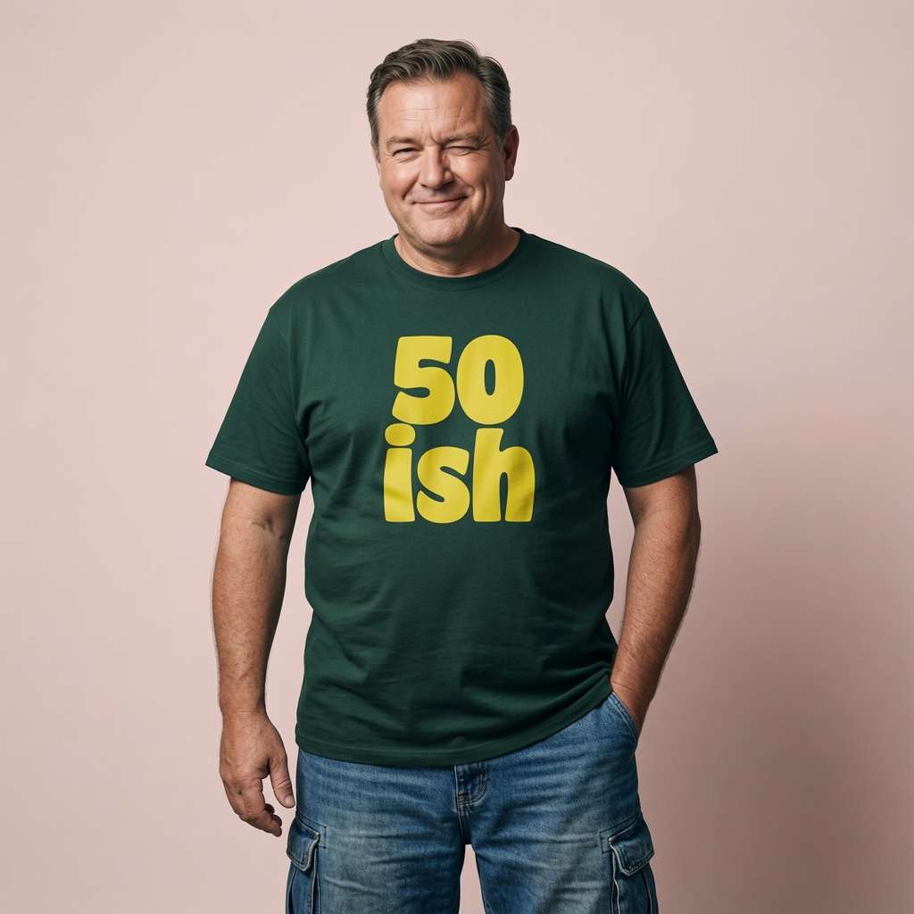 Man winking with hand in pocket in green 50 ish t-shirt, mens witty 50 year slogan