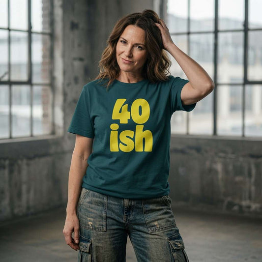 Woman posing with hand in hair in green 40 ish tee, fun ladies 40th birthday slogan