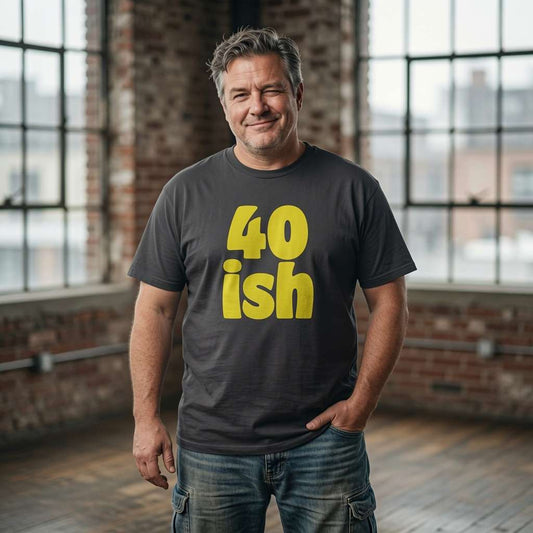Grey-haired man with hand in pocket in black 40 ish tee, fun mens 40th birthday