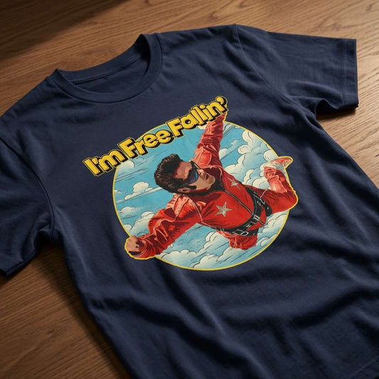 French navy I’m Free Fallin’ t-shirt on wood featuring skydiver in red jumpsuit, fun 90s music inspired mens graphic