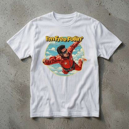 White I’m Free Fallin’ t-shirt on concrete featuring skydiver in red jumpsuit, ladies 90s music inspired graphic
