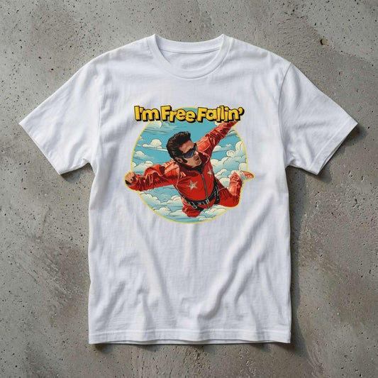 White I’m Free Fallin’ t-shirt on concrete featuring skydiver in red jumpsuit, ladies 90s music inspired graphic