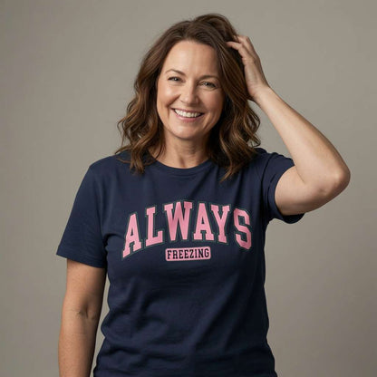Woman smiling with hand in hair in navy Always Freezing t-shirt, funny ladies relatable slogan