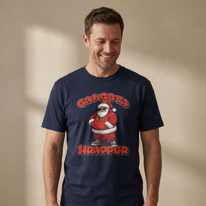 A man wearing a navy blue t-shirt with a graphic of a Santa Claus character and the text 'GANGSTA WRAPPA'.