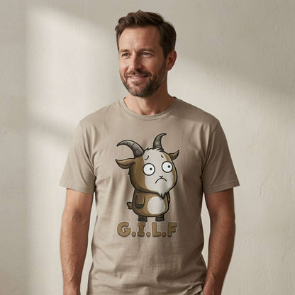 Man smiling in stone beige G.I.L.F. t-shirt featuring wide-eyed cartoon goat, funny witty mens goat graphic