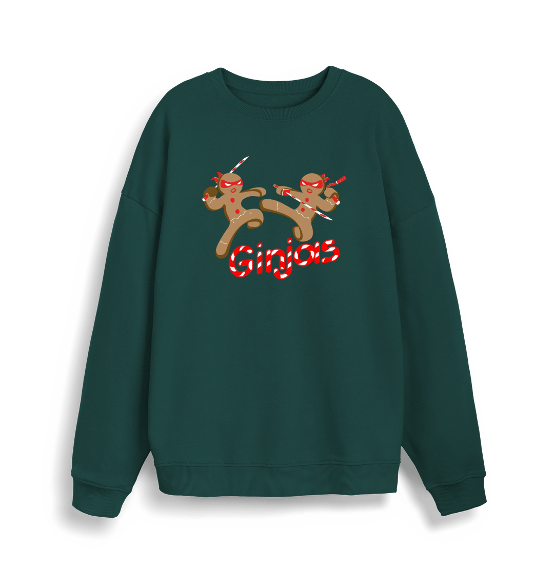 green christmas sweater with the graphic of two gingerbread men fighting with candy canes and the slogan 'ginjas'