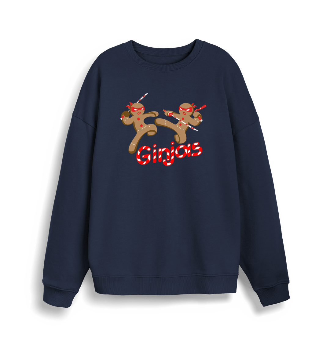 navy christmas sweater with the graphic of two gingerbread men fighting with candy canes and the slogan 'ginjas'
