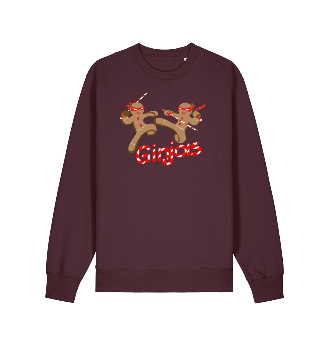 red brown christmas sweater with the graphic of two gingerbread men fighting with candy canes and the slogan 'ginjas'