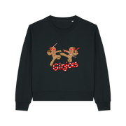 black christmas sweater with the graphic of two gingerbread men fighting with candy canes and the slogan 'ginjas'