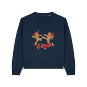 navy christmas sweater with the graphic of two gingerbread men fighting with candy canes and the slogan 'ginjas'