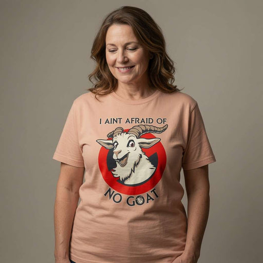 Woman smiling looking down in peach I Ain’t Afraid of No Goat t-shirt, funny ladies goat pun animal graphic